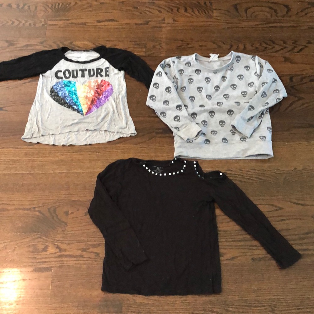 Assorted girls long sleeve shirts.